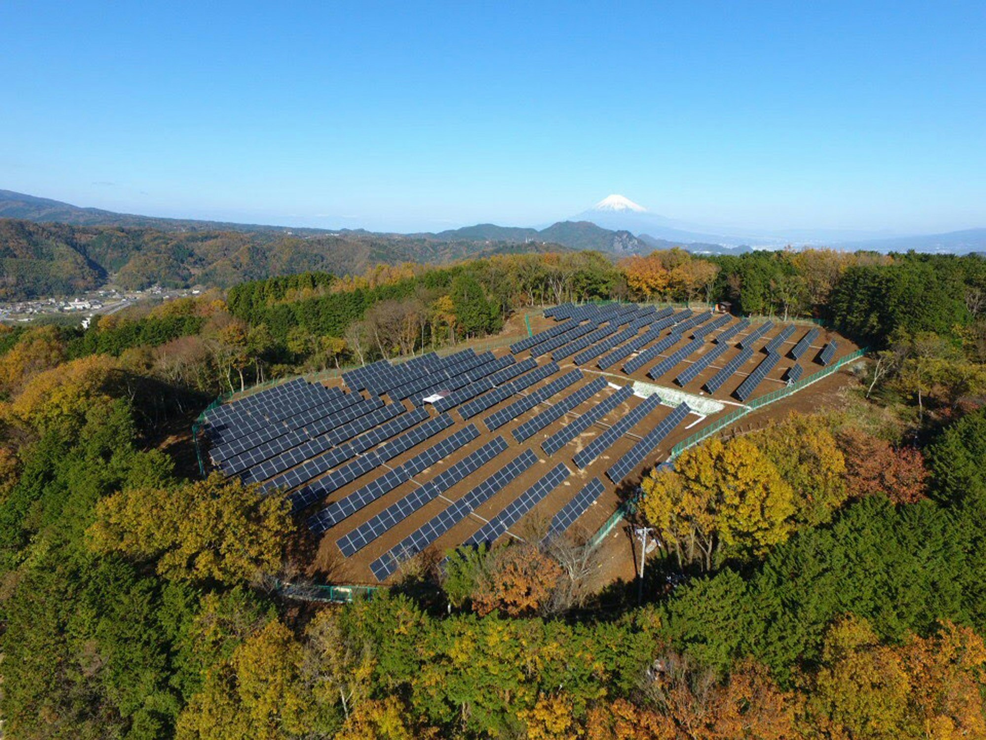 Close-up of modern monocrystalline solar panels reflecting the sky